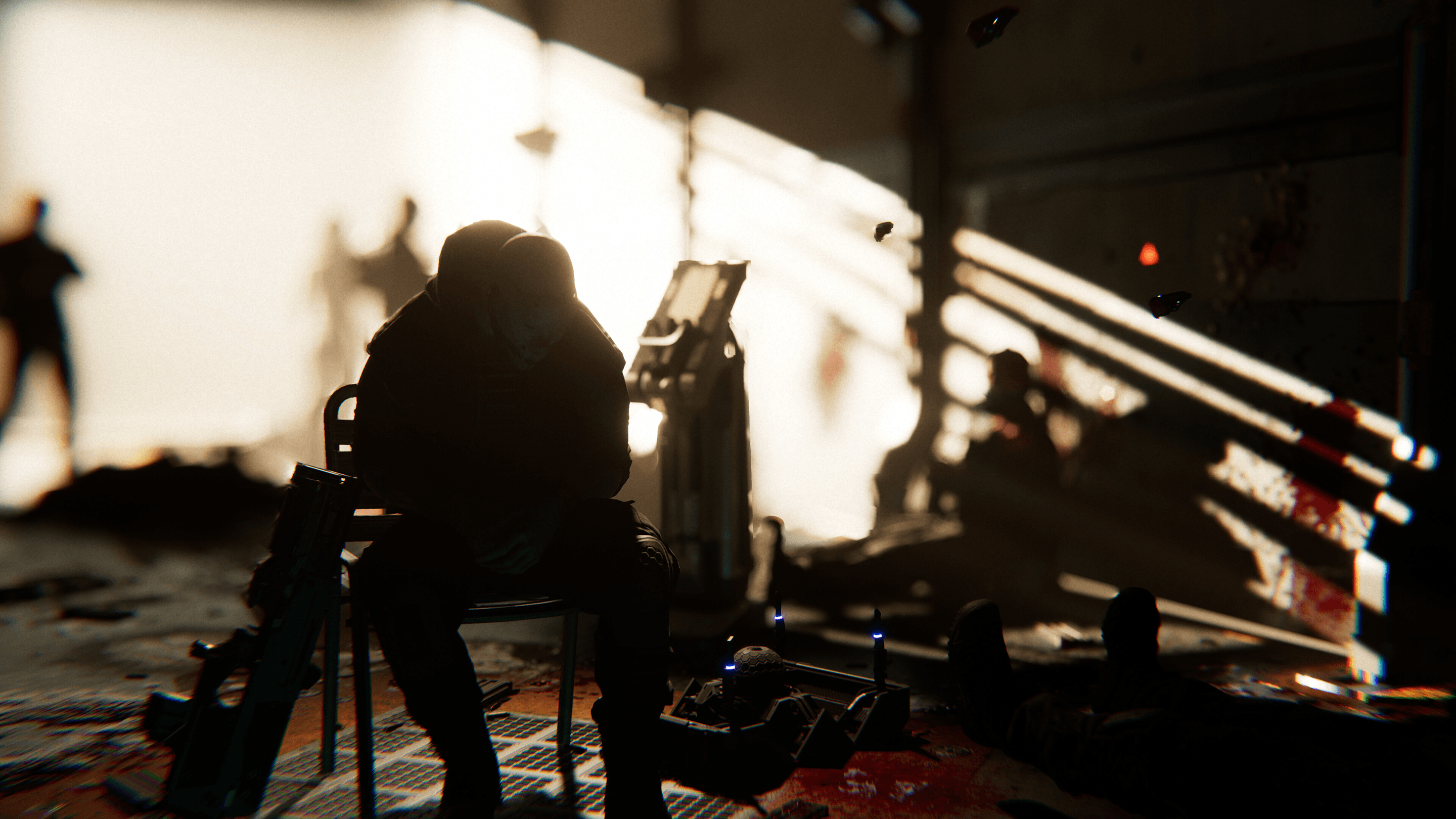 Person sitting on a chair with his weapon leaning against it